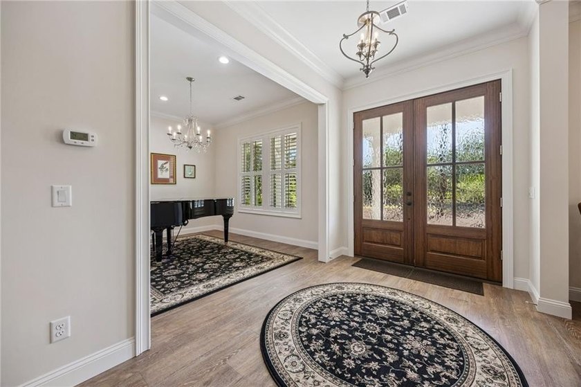 Welcome to refined coastal living in the highly sought-after - photo 3