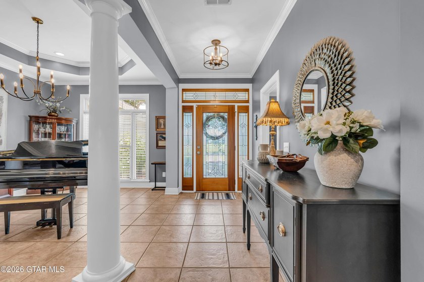 Nestled on approximately 1.5 beautifully landscaped acres in the - photo 4