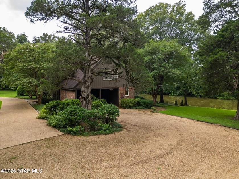 Set on 4.04 acres with pond frontage, this custom-built - photo 6