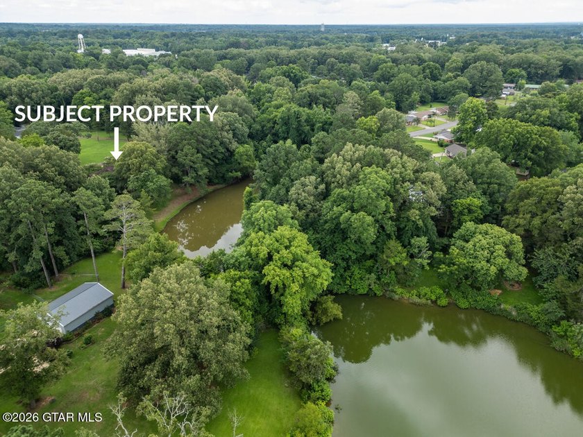 Set on 4.04 acres with pond frontage, this custom-built - photo 10