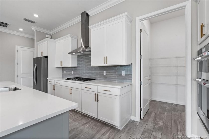 Welcome to this 2022 custom CBS home in Veranda Gardens. Prime - photo 13