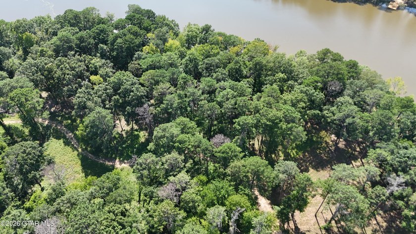Lot 3 Tucked among mature trees, this scenic lot is ideal for - photo 5