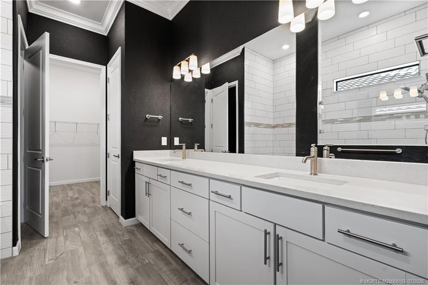 Welcome to this 2022 custom CBS home in Veranda Gardens. Prime - photo 22