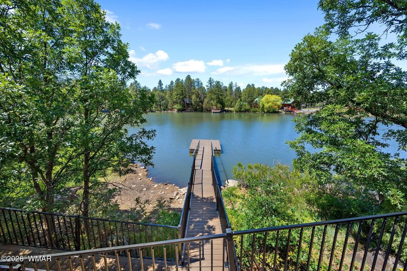 Wake up to breathtaking furnished waterfront views from this - photo 2