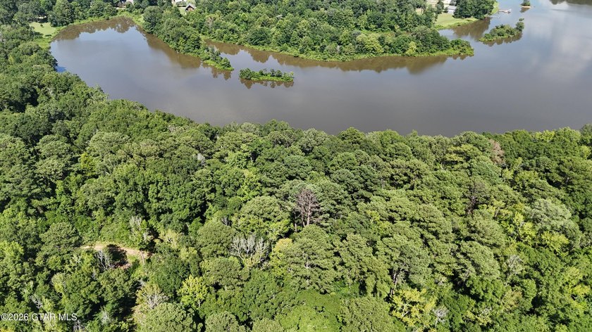 Lot 17 Nestled in a quiet setting, this wooded lot provides the - photo 9
