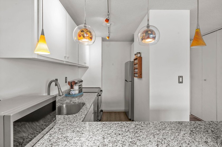 Move-in ready and beautifully updated, this River Towers condo - photo 33