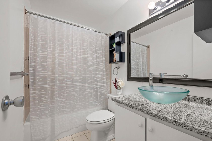 Move-in ready and beautifully updated, this River Towers condo - photo 43