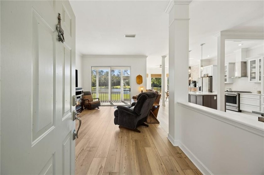 THIS BEAUTIFULLY UPDATED THREE-BEDROOM HOME IN OSPREY COVE IS - photo 9