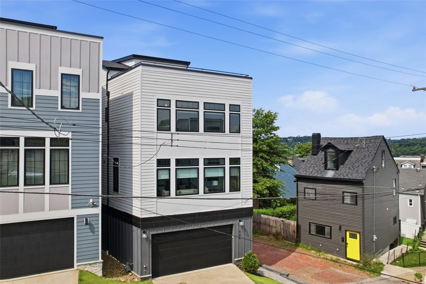 Welcome to 724 52nd Street, a striking free-standing modern - photo 2