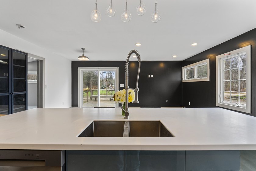 variety of lifestyles. The bright, inviting kitchen and - photo 10