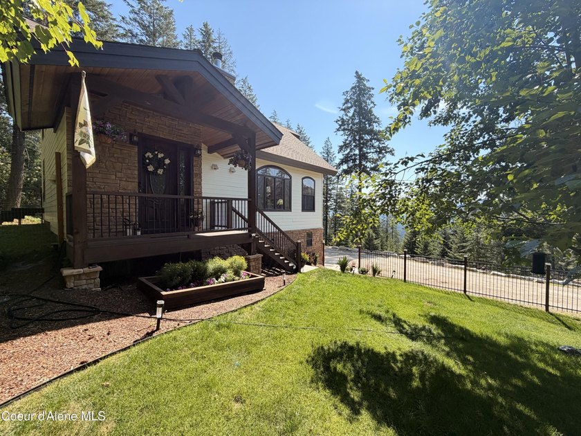 Welcome to your mountain escape in scenic Sagle, Idaho! This - photo 3