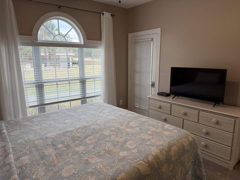 Welcome home to this golf course view condo located in the - photo 11