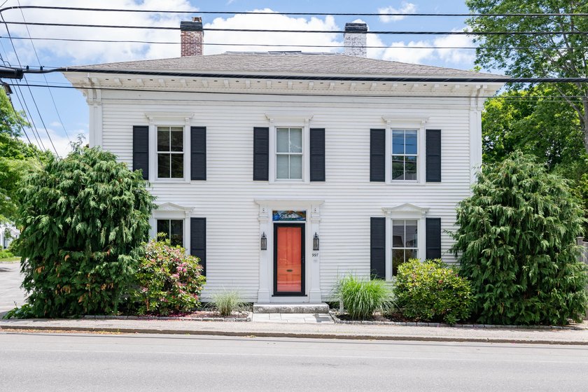 This beautiful 3,238 square foot c. 1832 Italianate sits in the - photo 2