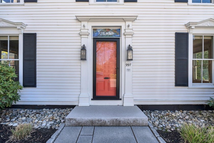 This beautiful 3,238 square foot c. 1832 Italianate sits in the - photo 3