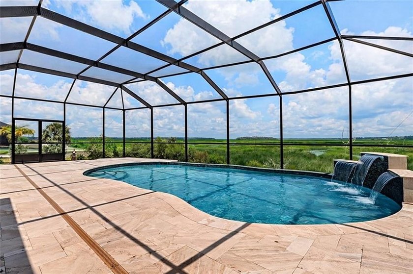 Welcome to a refined coastal sanctuary in the gated enclave of - photo 7