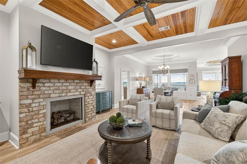 Welcome to a refined coastal sanctuary in the gated enclave of - photo 9