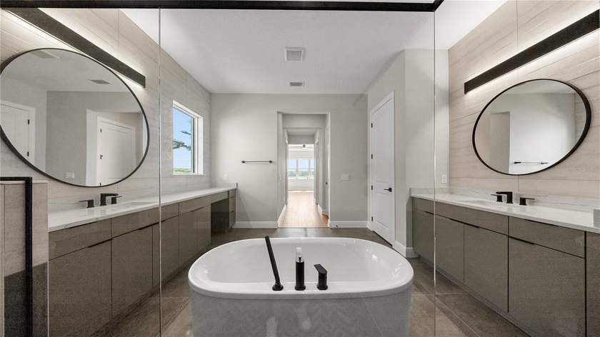 This never-lived-in luxury residence presents an extraordinary - photo 17