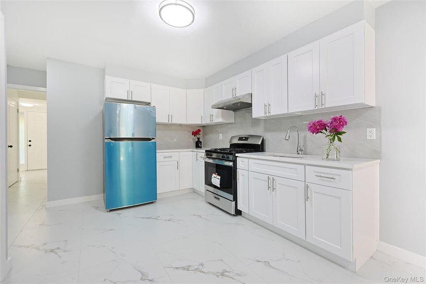 Welcome to this fully renovated 2-Family Condo Townhouse located - photo 11