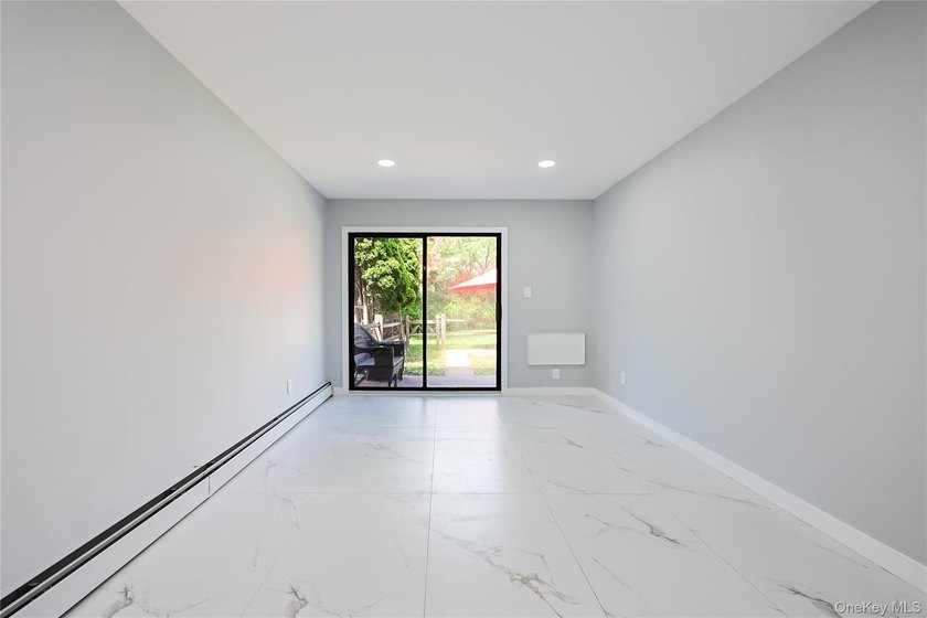 Welcome to this fully renovated 2-Family Condo Townhouse located - photo 17