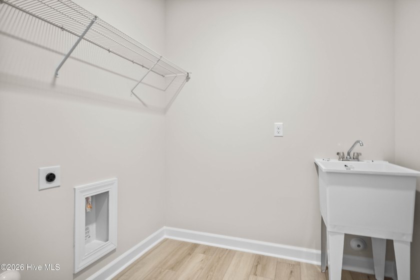 The Cherry Grove model offers a spacious and inviting retreat - photo 9