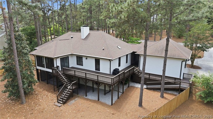Exceptional home nestled on over one acre within the exclusive - photo 5