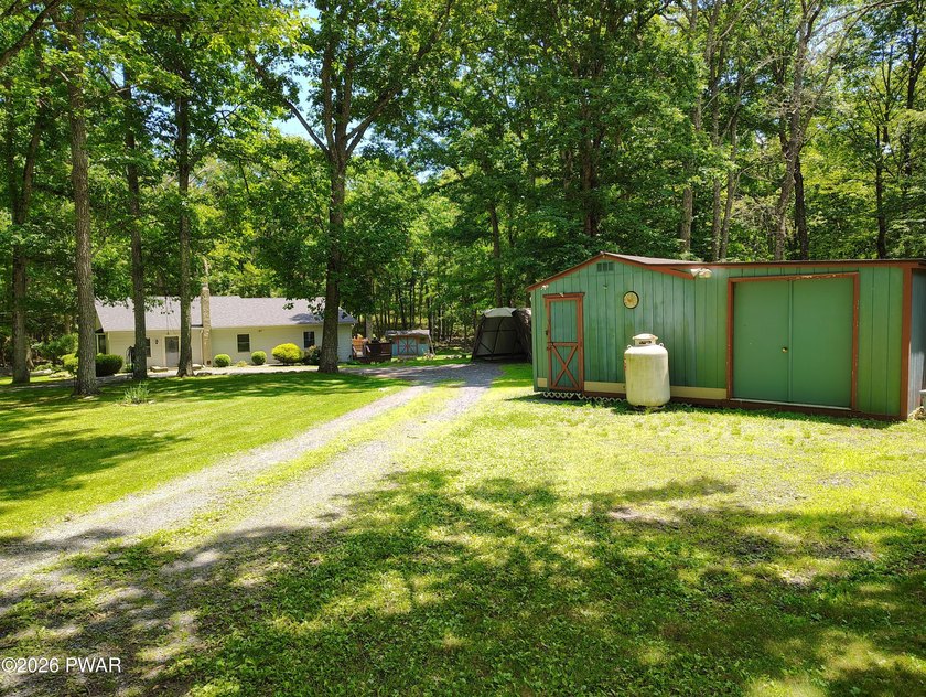 Nestled near Peck's Pond, this 2 bedroom ranch home sits on .6 - photo 2