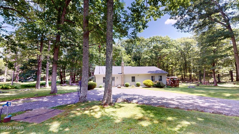 Nestled near Peck's Pond, this 2 bedroom ranch home sits on .6 - photo 3