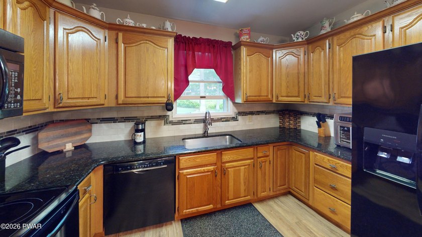 Nestled near Peck's Pond, this 2 bedroom ranch home sits on .6 - photo 8