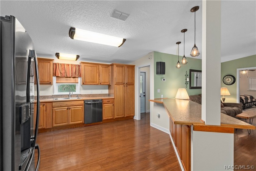 Tucked away on a beautiful wooded 1-acre waterfront lot in the - photo 14
