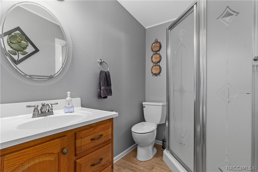 Tucked away on a beautiful wooded 1-acre waterfront lot in the - photo 17
