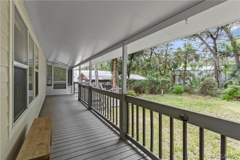 Tucked away on a beautiful wooded 1-acre waterfront lot in the - photo 27