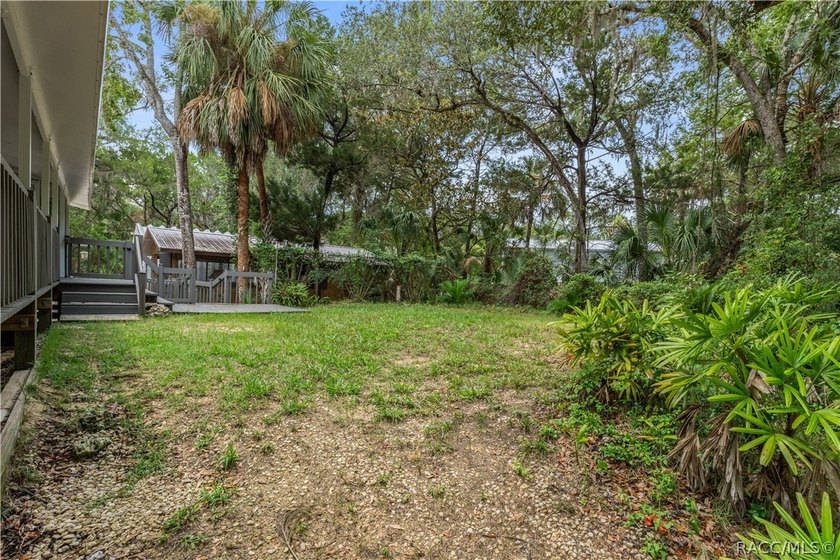 Tucked away on a beautiful wooded 1-acre waterfront lot in the - photo 30
