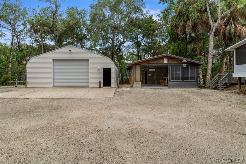 Tucked away on a beautiful wooded 1-acre waterfront lot in the - photo 32