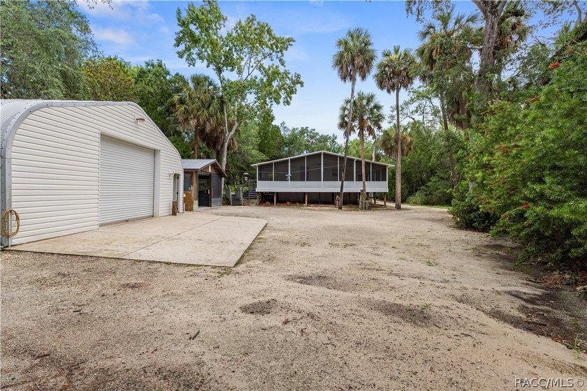 Tucked away on a beautiful wooded 1-acre waterfront lot in the - photo 37