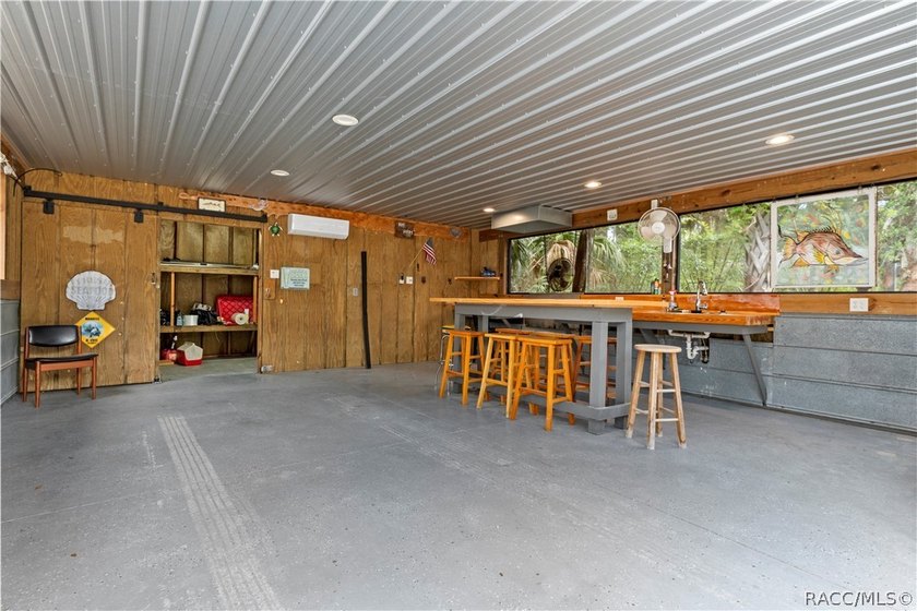 Tucked away on a beautiful wooded 1-acre waterfront lot in the - photo 39