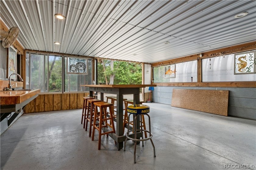 Tucked away on a beautiful wooded 1-acre waterfront lot in the - photo 41