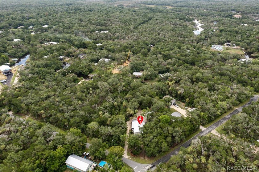 Tucked away on a beautiful wooded 1-acre waterfront lot in the - photo 49