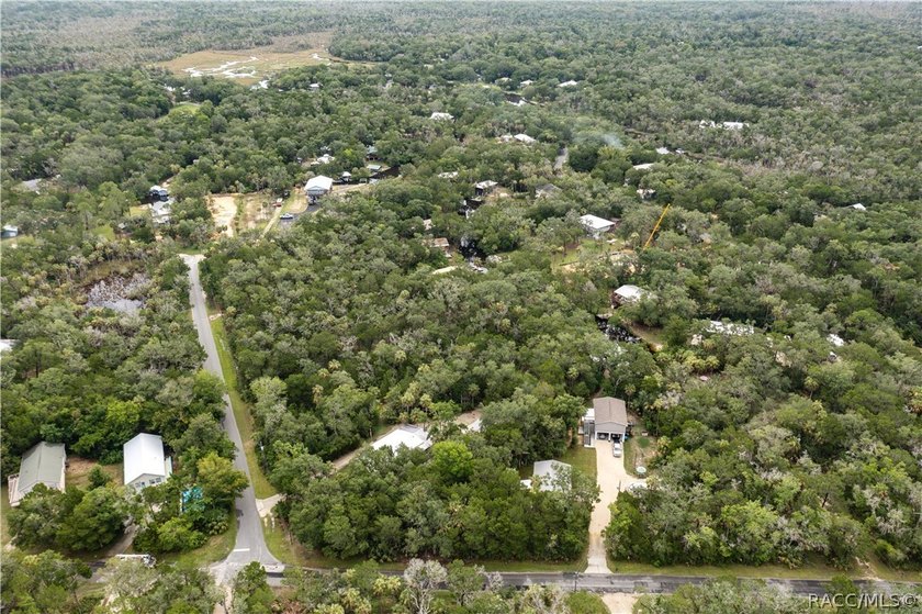 Tucked away on a beautiful wooded 1-acre waterfront lot in the - photo 50