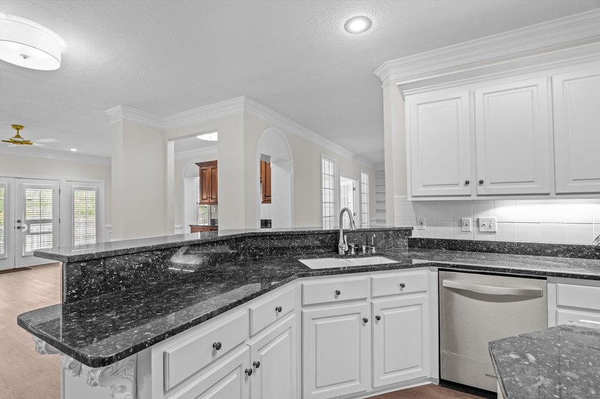 Welcome to this stunning 5-bedroom, 4.5-bath home located in the - photo 18