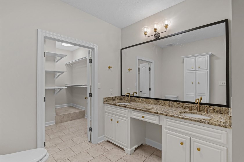 Welcome to this stunning 5-bedroom, 4.5-bath home located in the - photo 33