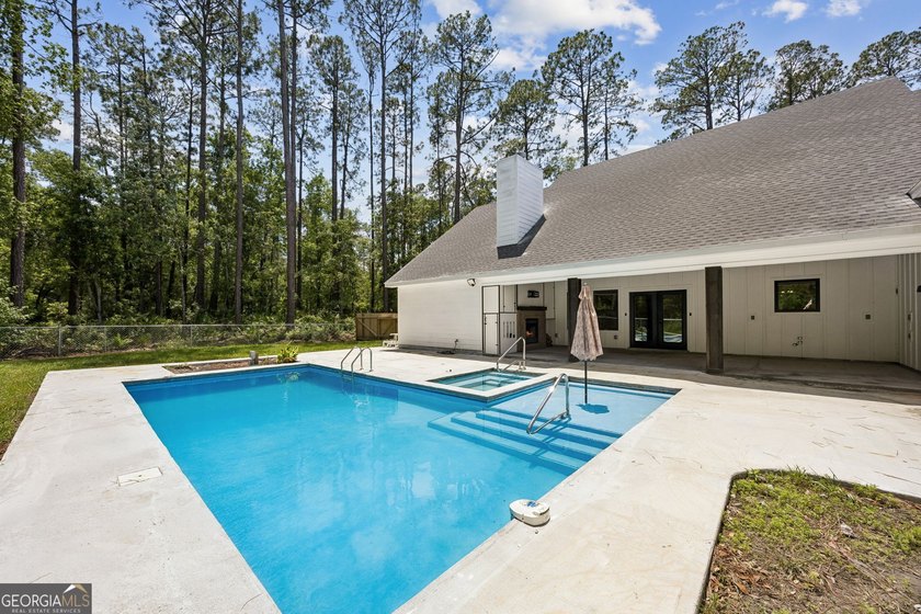 This custom-built home is situated on approximately 3 acres and - photo 2