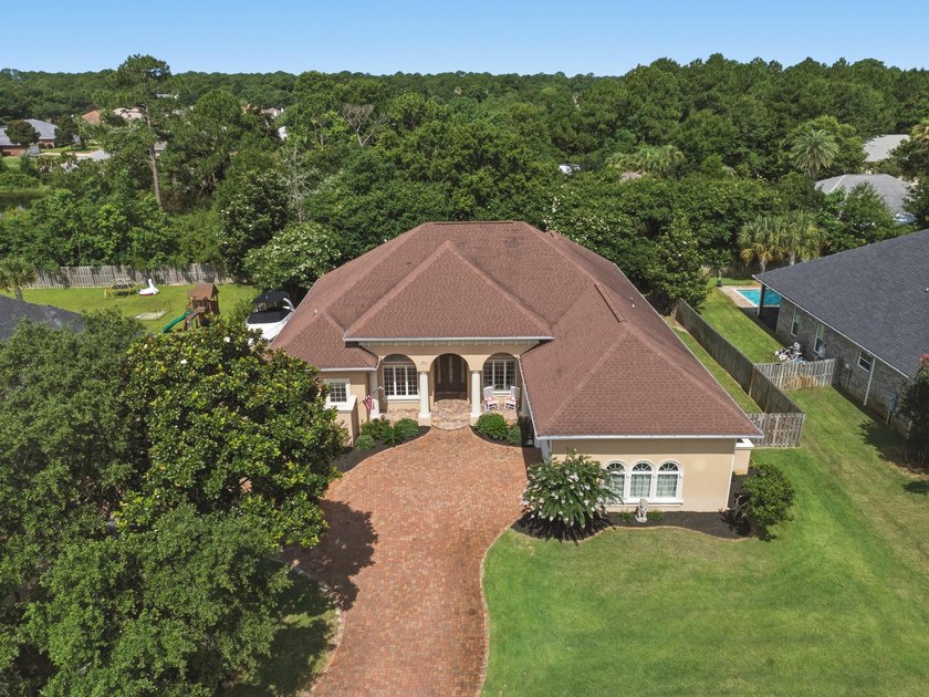 Nestled within the gated community of Soundside Shores, this - photo 50