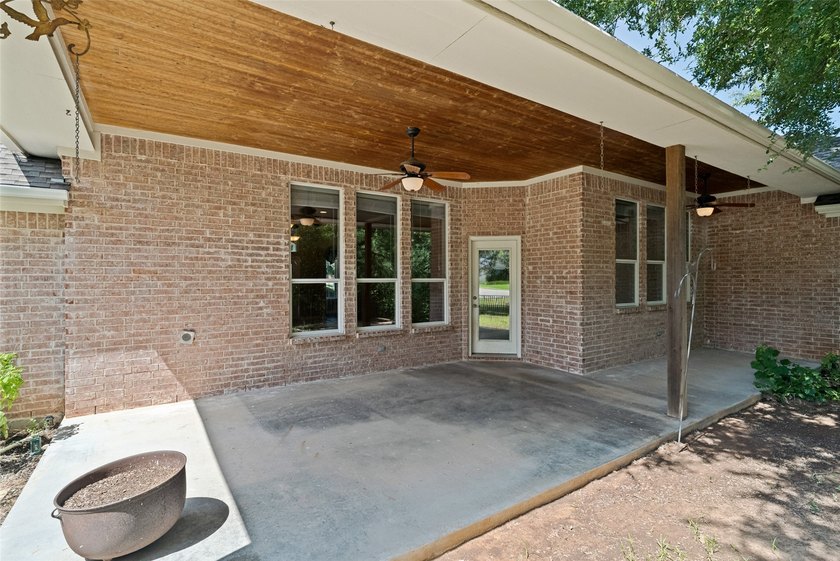 Nestled on a beautifully landscaped .335-acre corner lot in the - photo 33