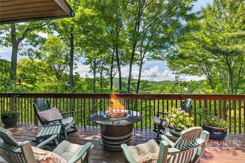 Magnificent home embraced by rhododendrons and hardwood trees - photo 3