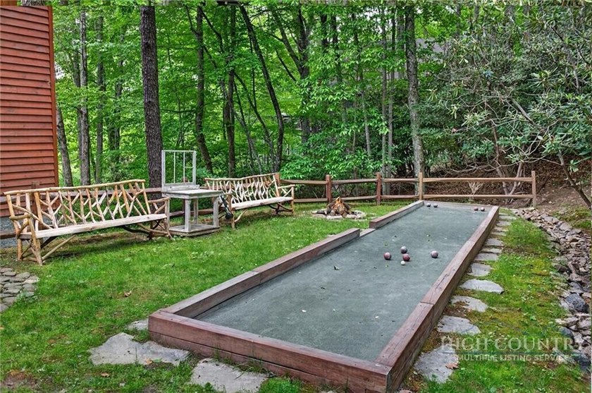 Magnificent home embraced by rhododendrons and hardwood trees - photo 10