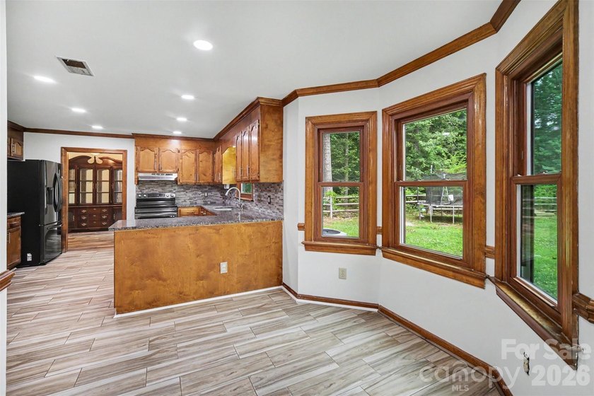 Nestled on approximately half an acre, this beautifully - photo 17