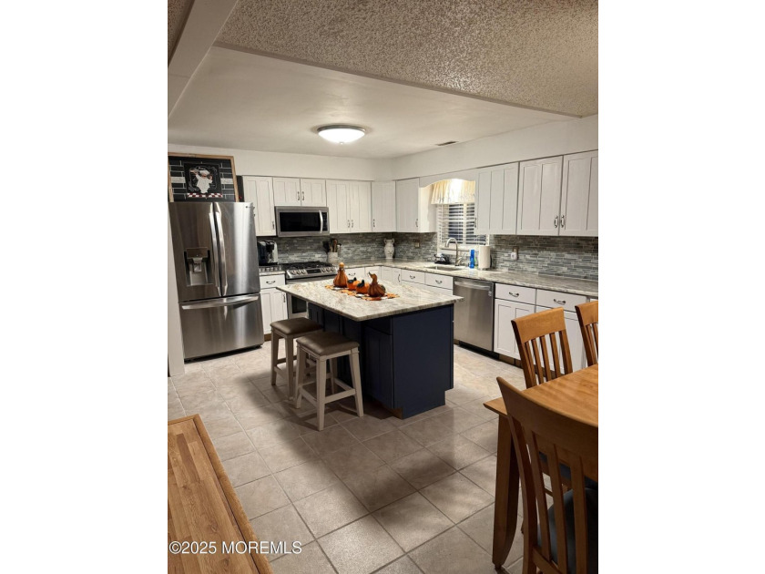 Home has all newer stainless steal appliances, granite counter - photo 23