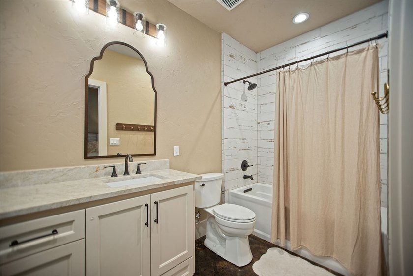 Custom-built barndominium blending charm with modern finishes - photo 14