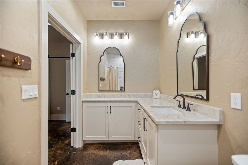 Custom-built barndominium blending charm with modern finishes - photo 16