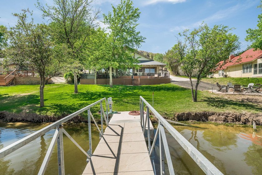 Experience the beauty of lakeside living in this stunning - photo 2